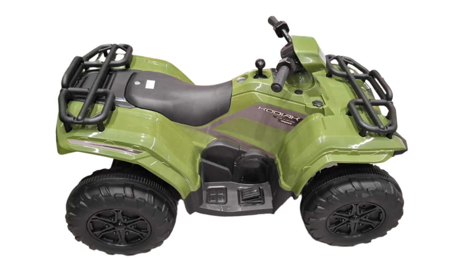 Green toy ATV on display in a store with other toys in the background