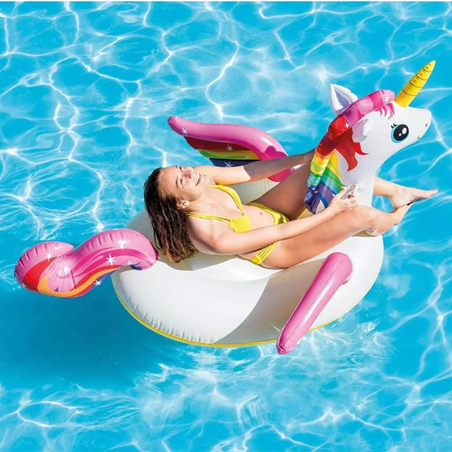 Intex Unicorn Ride-On Inflatable Pool Float with Handles – 155 x 79 x 79 cm | Ages 3+ | Rainbow Sprayer Design