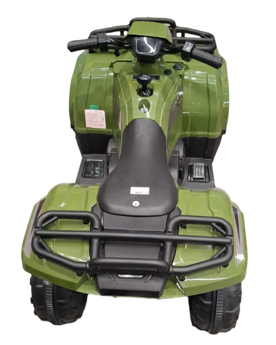 Green toy quad bike on a tiled floor