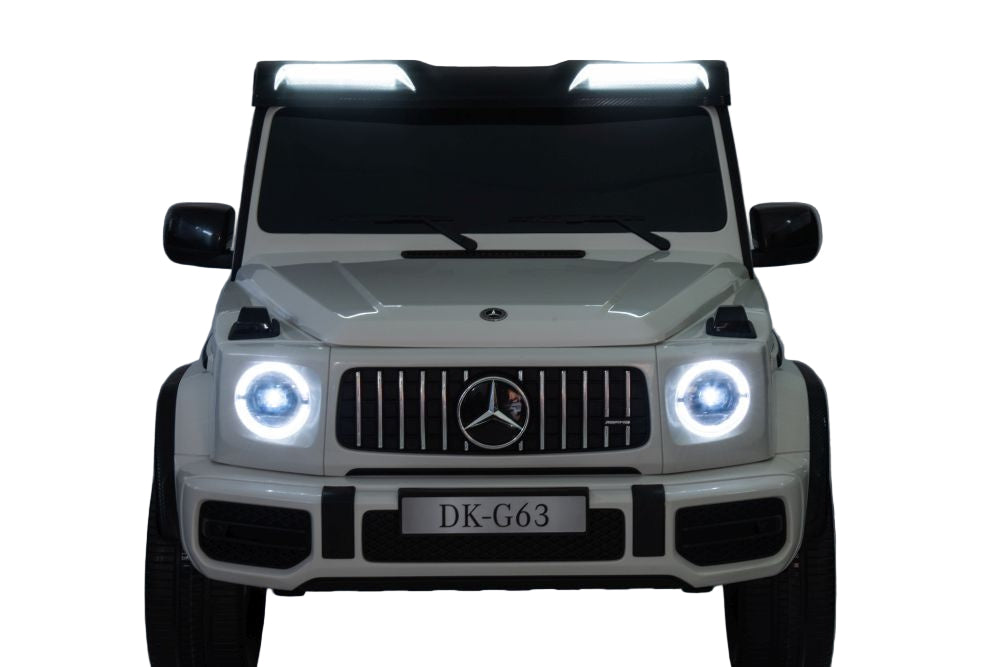 White toy car with Mercedes-Benz logo on a white background